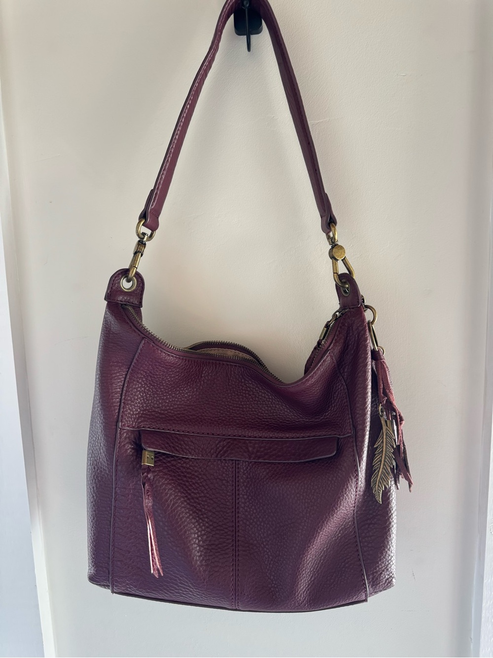 The Sak Deep Burgundy Leather Alameda Hobo Bag with Tassel & Feather Charm